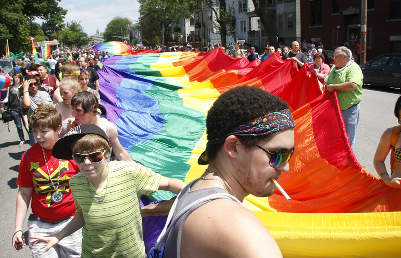 A rainbow-colored flag is carried down Park Street during the 25th annual Southern Maine Pride Parade on Saturday. The flag covered the width of the street and stretched for two blocks. “Portland is a great place when you talk tolerance,” said Police Chief James Craig.