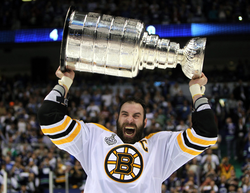 Bruins captain Zdeno Chara hoists the Stanley Cup after Boston beat the Vancouver Canucks on their home ice last week for the NHL title. Would it be fun for 6-foot-9 Chara to team up with 5-foot-4 Charo for a tour?