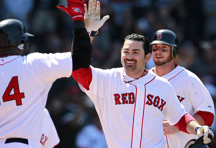 Boston Red Sox's Adrian Gonzalez, center, celebrates his two-run home run that drove in Jarrod Saltalamacchia, right, in Sunday's game against the Athletics.