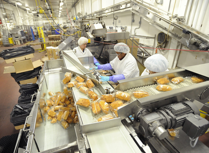 Barber Foods workers package stuffed chicken breasts in this December 2010 photo.