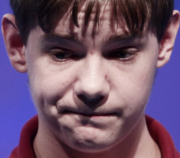 Tony Incorvati, 13, from Canton, Ohio, reacts after spelling "syringadenous" incorrectly during the semifinals.