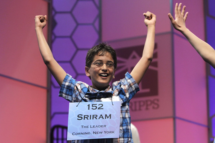 Sriram Jagadeesh Hathwar, 11, from Corning, N.Y., celebrates on being told that he made it into the final round of the National Spelling Bee.