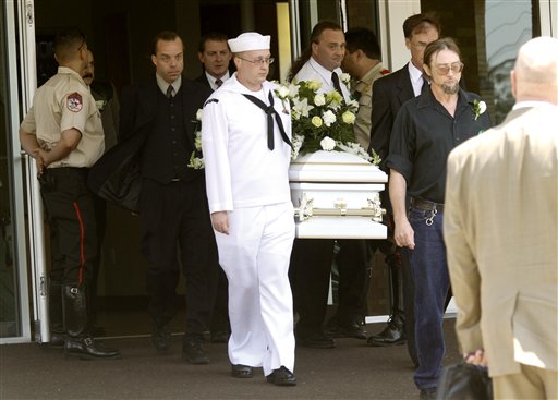 Ian McCrery, front, brother of Camden Hughes, carries the casket of his younger brother Camden Pierce Hughes during a memorial service at Calvary Baptist Church in Grand Priaire, Texas. Julianne McCrery of the Dallas suburb of Irving is being held without bail on second-degree murder charges in New Hampshire. She's accused of killing her son there two weeks ago and dumping his body in Maine. Preliminary autopsy findings show he died of asphyxiation. (AP Photo/Jeffery Washington)