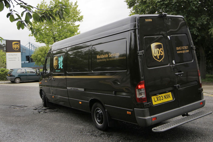 A UPS van arrives back at a depot in north London today. UPS told customers that some shipments from Britain were being delayed but would not say where those delayed packages were supposed to be heading.