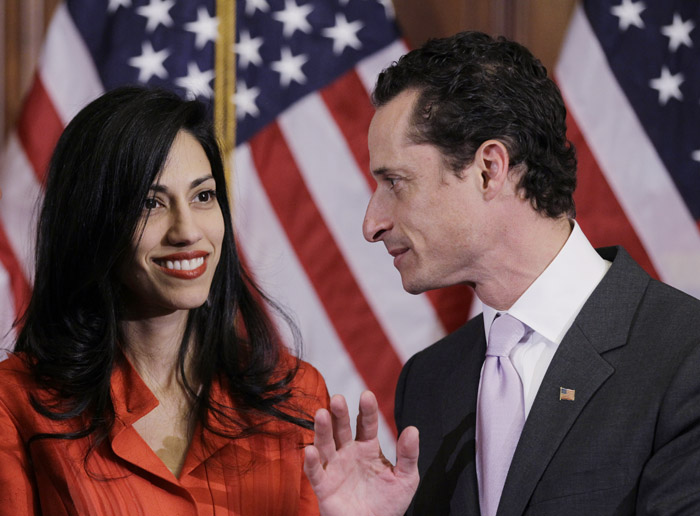 A Jan. 5, 2011, photo of Rep. Anthony Weiner, D-N.Y., and his wife, Huma Abedin, aide to Secretary of State Hillary Rodham Clinton. Sources say Weiner is waiting for Abedin to return from an overseas trip before making a decision on whether or not to resign.