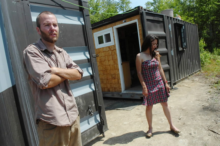 Trevor Seip and Jennifer Sansosti stand outside their shipping container home in Ellsworth. The couple have transformed two 20-foot-long containers - which they bought on eBay - into their home.