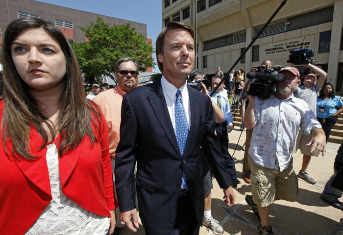 John Edwards, right, leaves the Federal Building with his daughter Cate Edwards, left, in Winston-Salem, N.C., today.