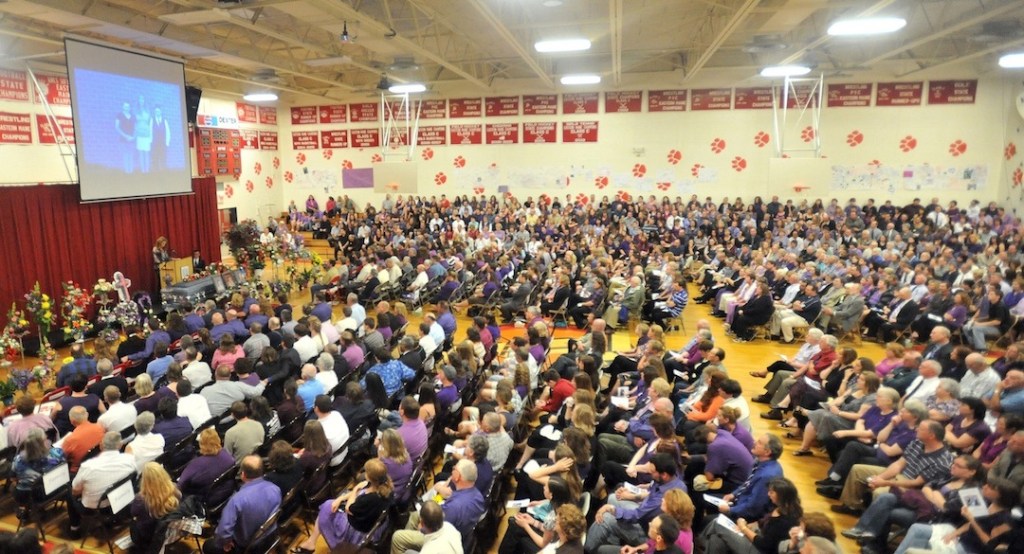 Family, friends and colleagues packed the gymnasium to remember Amy, Coty and Monica Lake during the funeral at Dexter Regional High School in Dexter on Saturday.