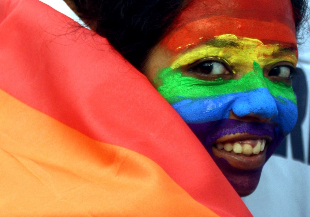 A gay-rights activist celebrates an Indian court ruling in 2009 that decriminalized homosexuality. The U.N. Human Rights Council in Geneva narrowly approved a gay-rights resolution Friday.