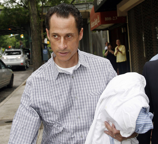 Rep. Anthony Weiner, D-N.Y., carries his laundry to a laundromat near his home in Queens recently.