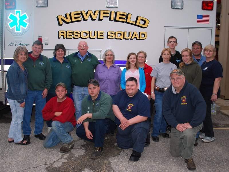 Some Winn family members recently posed with members of the Newfield Rescue Squad. From left in the back are Ann Winn-Wentworth, Tom Johnson, Hazel McGlincey, Dick McGlincey, Linda Bishop, Lydia (Winn) Mowry, Helen Winn, Denise D'Angelis, Robbie Elliott, Ashley Young, Rob Elliott and Wendy Elliott. Kneeling from left are Jeremy Burbank, Andy Poole, Nick Santangelo and Dick King.