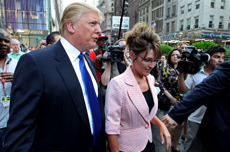 Former Alaska Gov. Sarah Palin walks with Donald Trump on the way to their scheduled meeting in New York City on Tuesday. “I’d love her to run” for president, he said.