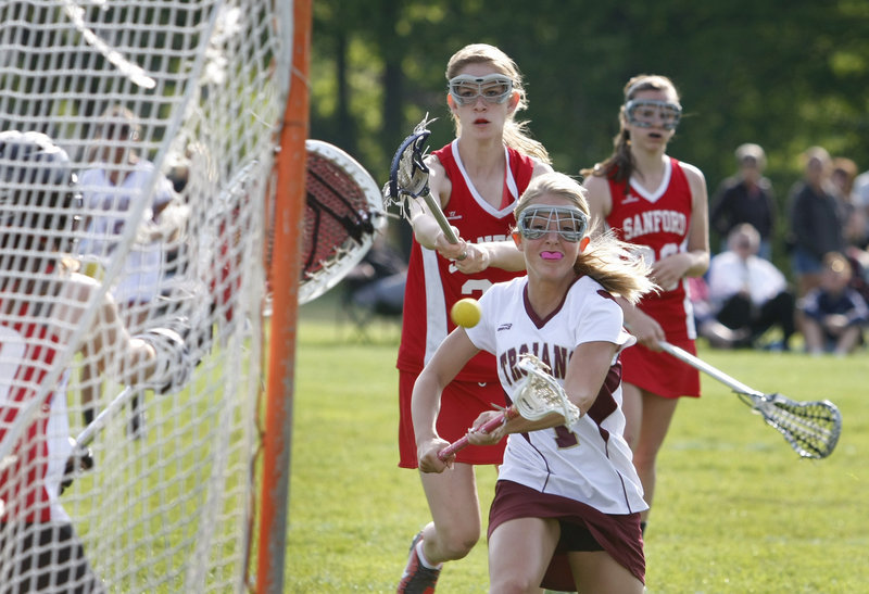 Kendra Ermold of Thornton Academy shoots while racing toward the net Tuesday, scoring a goal that helped the Golden Trojans collect a 17-2 victory against Sanford in a schoolgirl lacrosse game at Saco.
