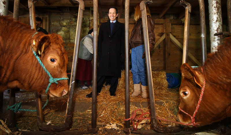 Presidential hopeful Rep. Dennis Kucinich, D-Ohio, visits a cattle farm near Ankeny, Iowa, in 2004. The overall direction of Republican politics in Iowa has swung rightward on social issues, even since the last election.