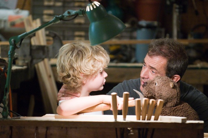 Riley Thomas Stewart and Mel Gibson in "The Beaver."