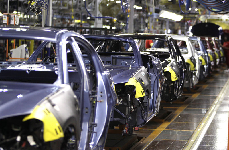 The new, midsize Chrysler 200, seen on an assembly line in Sterling Heights, Mich., helped the automaker achieve a 10 percent sales hike over May 2010.