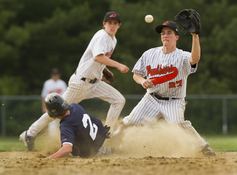 Tom McGuckin of North Yarmouth Academy takes the late throw Wednesday as pinch-runner Davis Brown of Yarmouth slides into second with a stolen base during Yarmouth s 12-4 victory in a regular-season finale.