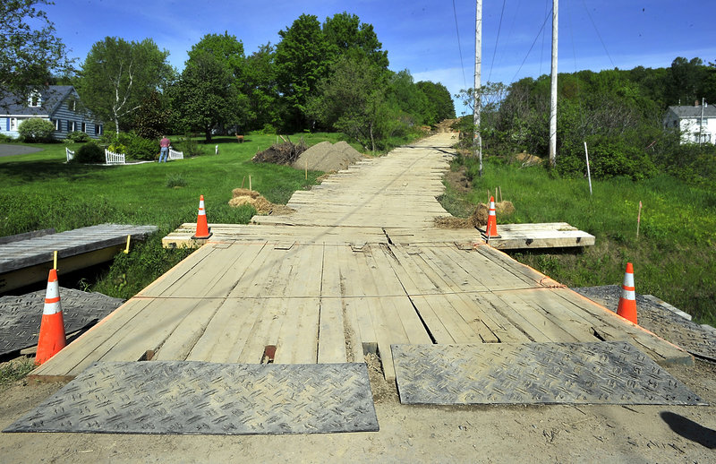 Central Maine Power is using hardwood mats, many made at Bear Hill Lumber in Hollis, to stop soil erosion from heavy machinery and trucks. This one crosses a stream along Leavitt Road in Augusta and leads to an electrical transmission corridor for current repair projects.