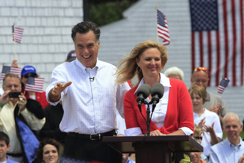 Former Massachusetts Gov. Mitt Romney, accompanied by his wife, Ann, arrives to announce his 2012 candidacy for president Thursday in Stratham, N.H.
