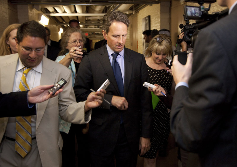 Treasury Secretary Timothy Geithner is followed by reporters after meeting with GOP House freshmen on Capitol Hill Thursday in Washington. Some Republicans say Geithner’s predictions of an economic disaster linked to the debt ceiling are meant to force a deal with GOP leaders.