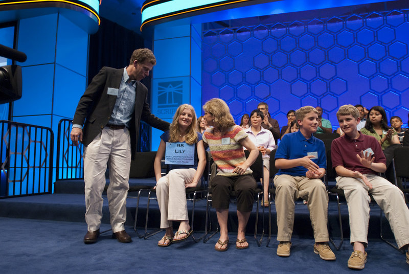 Maine champion speller Lily Jordan rejoins her family, parents Glenn and Nancy Jordan and her brothers Nathaniel and Jacob Jordan, after she was eliminated from the National Spelling Bee on Thursday night.