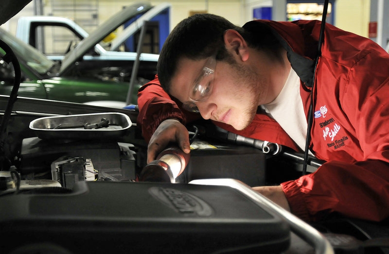Anthony Perron works on a car Friday in the Westbrook Regional Vocational Center’s garage. Perron and classmate Joshua Beeler will participate in the Ford/AAA Student Auto Skills national competition in Michigan.