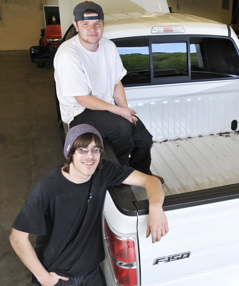 Anthony Perron of Scarborough, top, and Joshua Beeler of Raymond will arrive at the national student auto skills competition in Michigan next week with no tools of their own – just a laptop and a DVD with protocols for repairing a 2011 Ford F150.
