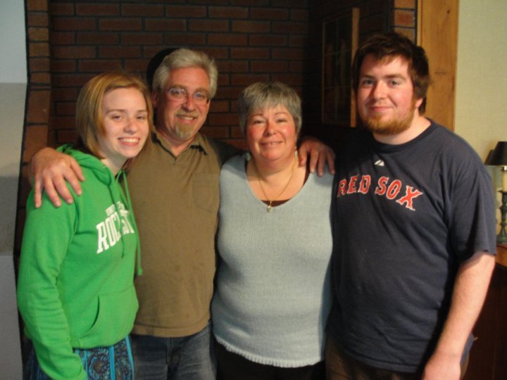 Andrew Holland, shown with his sister Carolyn and parents, Ward and Lynne, died Tuesday of a gunshot wound. A friend has been charged with manslaughter in his death.