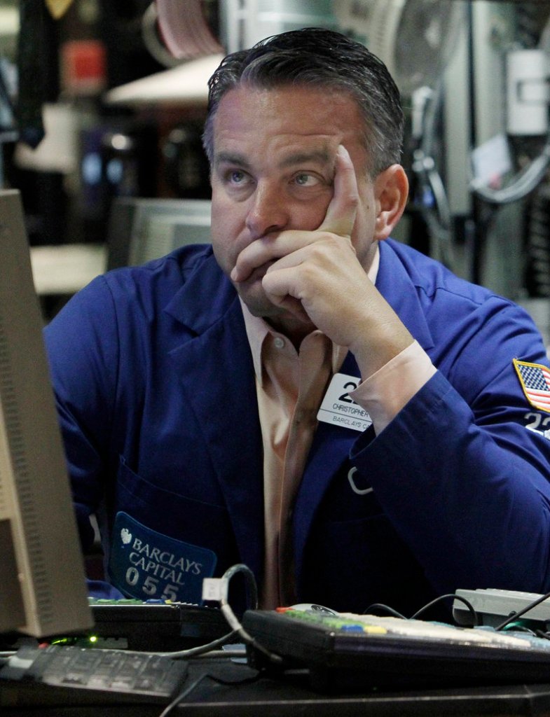 Christopher Culhane works at his post on the floor of the New York Stock Exchange Friday.