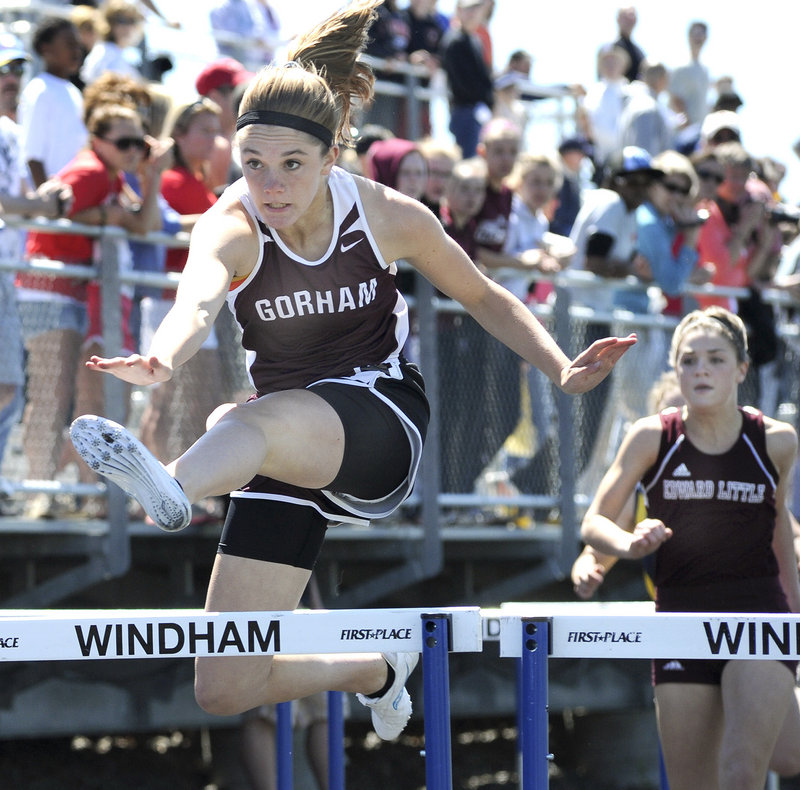 Sarah Perkins of Gorham wins a preliminary heat of the 100-meter hurdles Saturday at the Class A championships Saturday in Windham. Perkins went on to win the final in 15.52 seconds.