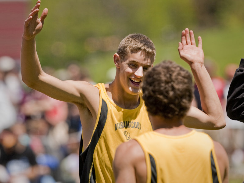 Chris Pelletier of Maranacook celebrates his victory in the triple jump Saturday in the Class C state meet at Bath.