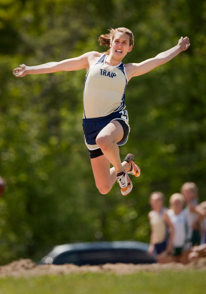 Carley O'Brien of Traip Academy hits her takeoff and travels 16 feet, 8 1/4 inches to finish first in the long jump in the Class C meet. O'Brien helped the Rangers capture the girls' team title, edging John Bapst by three points.