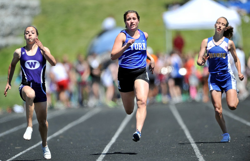 Emily Mitchell, center, of York competes in the 100-meter dash in the Class B meet. Mitchell was runner-up in the finals to Georgia Bolduc of Waterville.