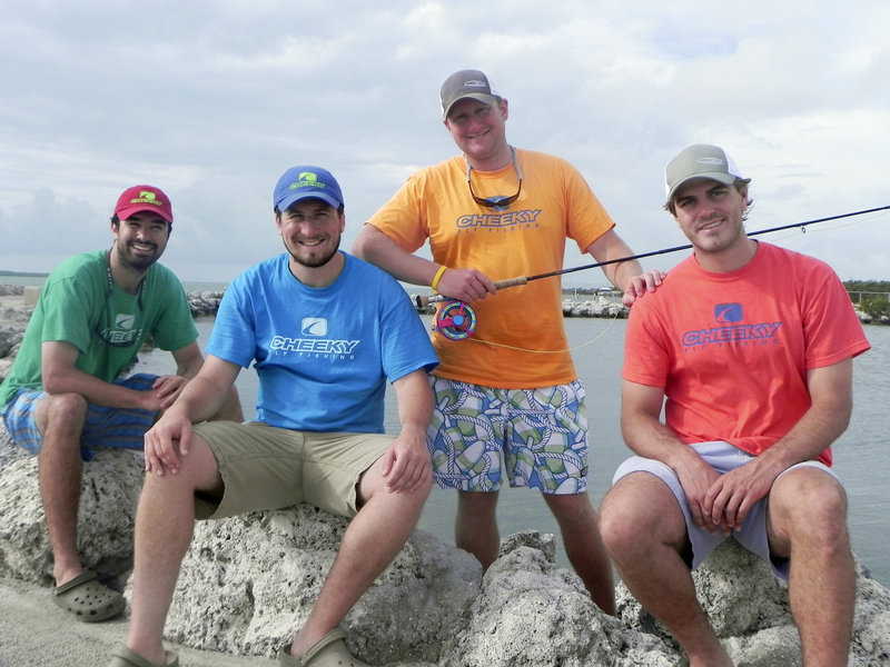 Cheeky Fly Fishing partners Peter Crommett, Ted Upton, Scott Caras and Max Key take a break from testing a prototype of their new fly reel in the Florida Keys.