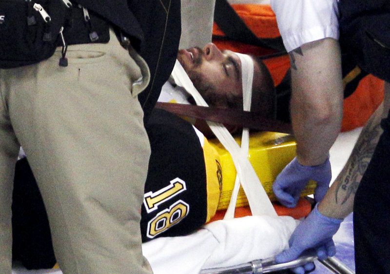 Nathan Horton is placed on a stretcher after Aaron Rome’s hit and is taken to a hospital. It was later reported Horton was moving his arms and legs.