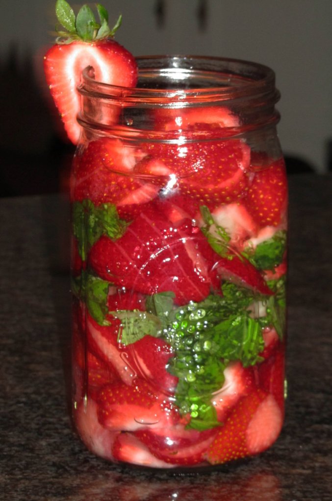 Vodka in this jar is being infused with the flavors of strawberries and basil.