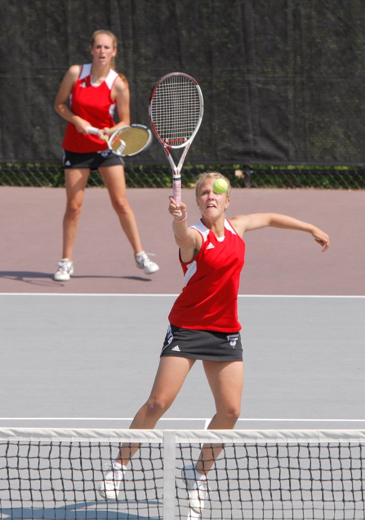 Maria Philbrick of Scarborough hits a shot at the net during a doubles match against Gorham in the Western Class A final. She and Courtney Hughes won to help the Red Storm take the title.