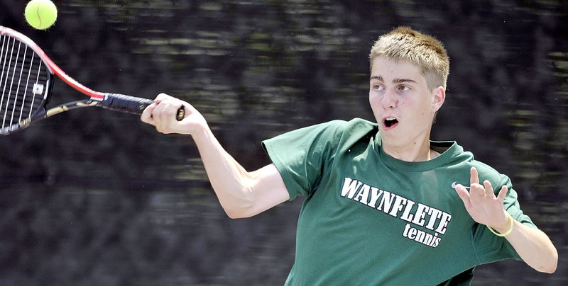 Eric Ordway of Waynflete hits a forehand in his match against Spencer Shagoury of Hall-Dale. Ordway helped the Flyers clinch their fourth straight boys' regional title.