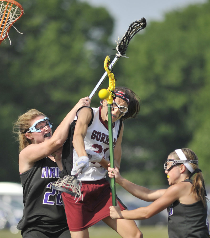 Mia Rapolla, center, of Gorham drew plenty of attention from Marshwood defenders Wednesday in a Western Class A girls lacrosse quarterfinal, but that didn't stop her from getting 10 goals in a 17-5 win.