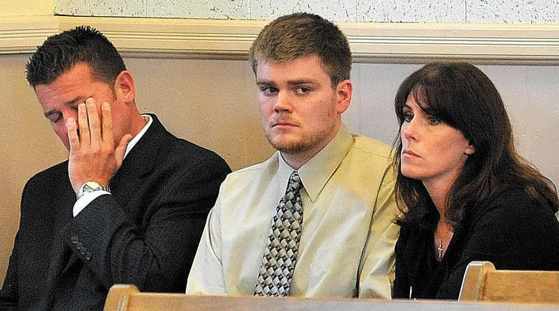 Ryan Ouimet sits with his parents, Robert and Michele Ouimet, during his first court appearance on a manslaughter charge in Franklin Superior Court on Wednesday.