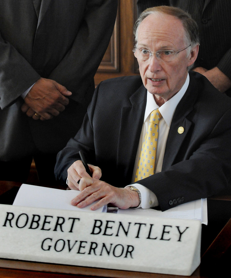 Gov. Robert Bentley of Alabama, seen at the state Capitol in Montgomery, signs Thursday what critics and supporters are calling the strongest bill in the nation aimed at cracking down on illegal immigration. The American Civil Liberties Union argues that the new law will invite racial profiling.