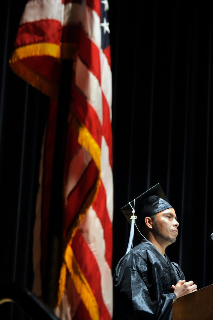 PAE graduate Selvin Arevalo shares his story about his efforts to remain in this country to receive an education despite being an undocumented immigrant during Thursday's ceremony.