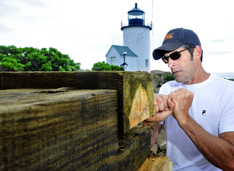 Alan Bartlett, a contractor from Kennebunkport, builds the base Friday for a new bell tower at the Goat Island Light Station off Cape Porpoise. The previous tower was torn down in the 1960s.