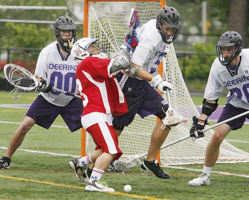 Luke Vigue of Messalonskee, in red, has the ball stripped by James Doyle of Deering during their Eastern Class A schoolboy lacrosse semifinal Saturday. Deering won, 8-6.