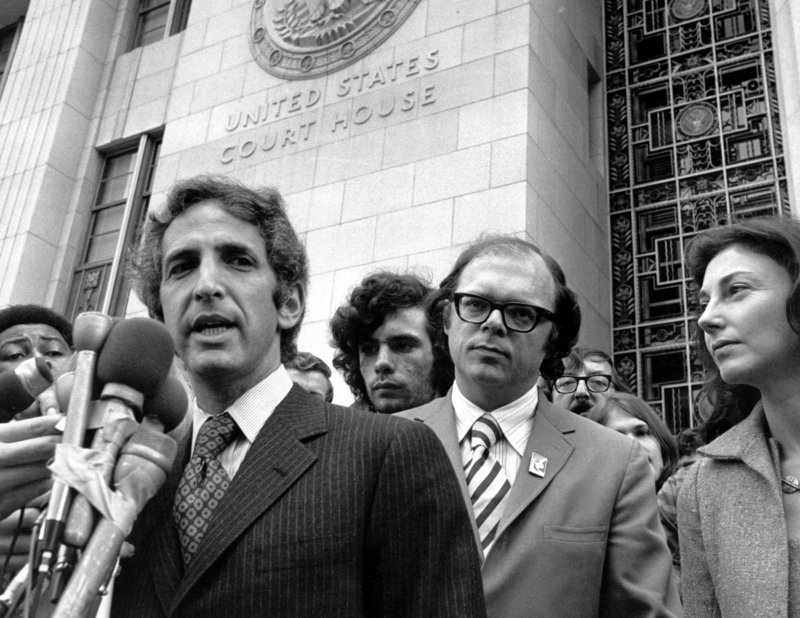 Daniel Ellsberg, who leaked the Pentagon Papers in one of the most dramatic acts of whistle-blowing in U.S. history, speaks to reporters outside the Federal Building in Los Angeles in this photo from Jan. 17, 1973. Ellsberg’s co-defendant in the case, Anthony Russo, is seen at right.
