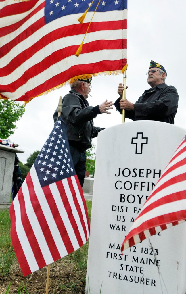 American Legion Post 17's Bob Wright, left, and Bill Chittick participate in the dedication ceremony Tuesday.