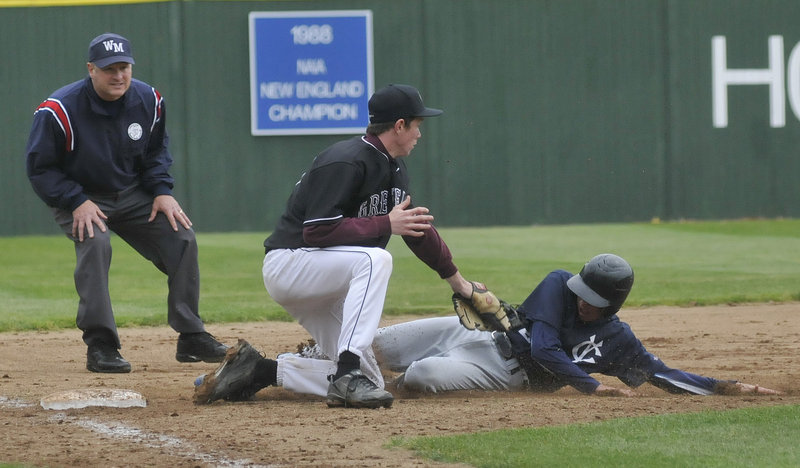 Third baseman Liam Maker of Greely tags out Davis Brown of Yarmouth, who was attempting to advance to third on a single Tuesday during Greely’s 8-6 victory in the Western Class B final at St. Joseph’s College.