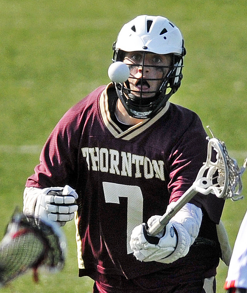 Parker Roma keeps his eye on the ball for Thornton Academy, which couldn t recover after falling behind early.