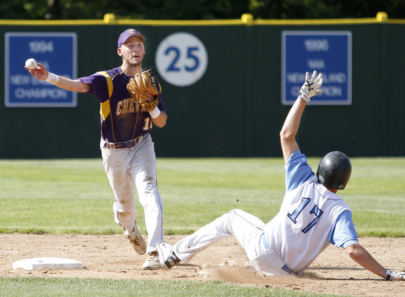 Zach Gardiner of Westbrook slides into second base as Nick Melville of Cheverus looks to complete a double play Wednesday in the sixth inning. Cheverus won, 2-0.