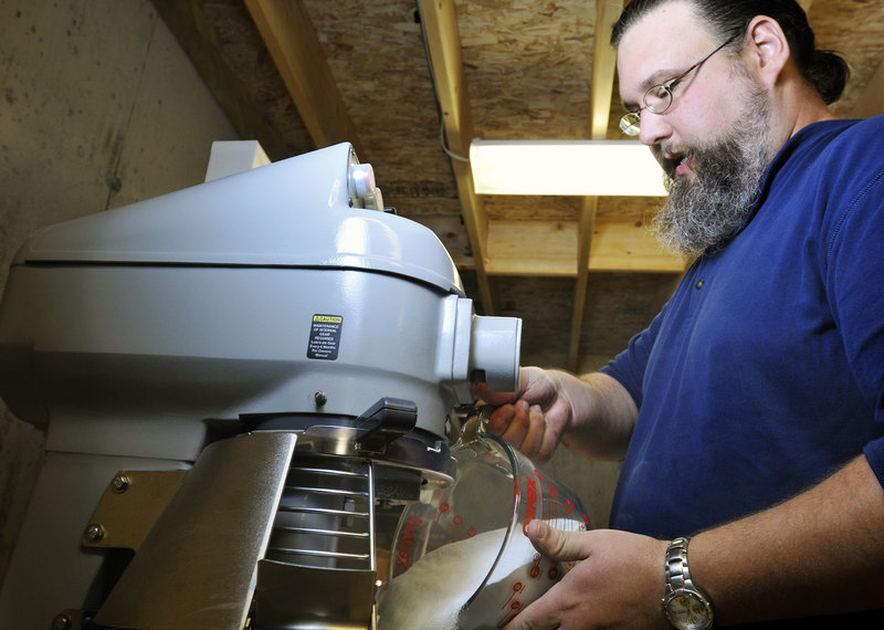 Doug Sanborn mixes his all-natural detergent in the basement of his home in Casco.